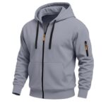 Men's grey athletic zip-up hoodie with hood, black zipper with orange pull, sleeve zip pocket, and kangaroo pockets - Athletic Line sportswear